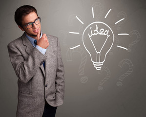 Young boy comming up with a light bulb idea sign