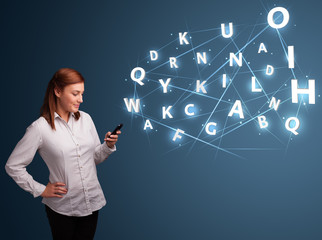 Young woman typing on smartphone with high tech 3d letters commi