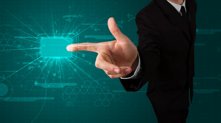 Businessman pressing high tech type of modern buttons
