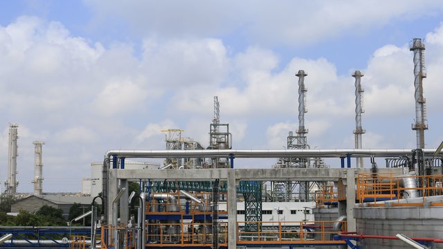 Oil and chemical industrial plant with cloudy sky