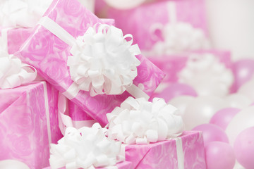 presents gift boxes, pink background for female or birthday