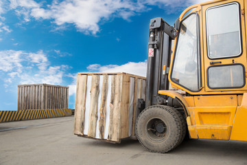 Forklift Truck Transporting Wood Cargo Box