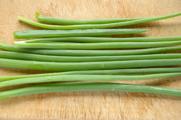 Chive on chopping board