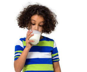 Little girl drinking a glass of milk