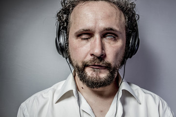 hate music, man with intense expression, white shirt