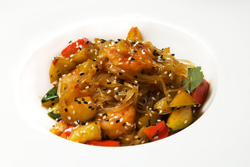 Salad with vegetables, rice noodles and sesame seeds