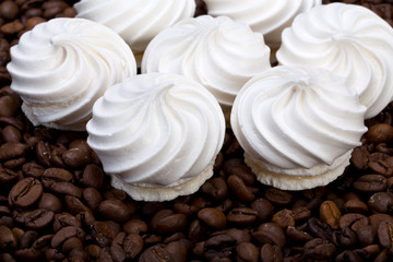 Fototapeta na wymiar French vanilla meringue cookies and coffee beans