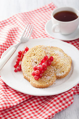 french toast with redcurrant and powder sugar for breakfast