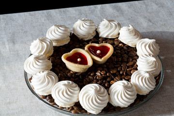 French vanilla meringue cookies and two sweet hearts