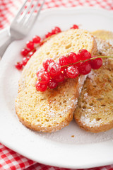 french toast with redcurrant and powder sugar for breakfast