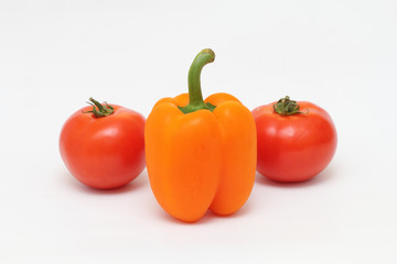 Two ripe tomatoes and peppers