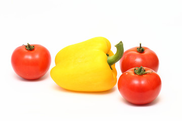 yellow bell pepper and three tomatoes