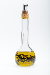 Thyme infused olive oil over white background
