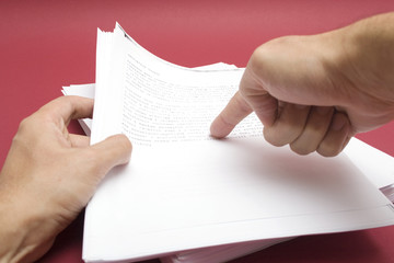 Finger pointing to a text.