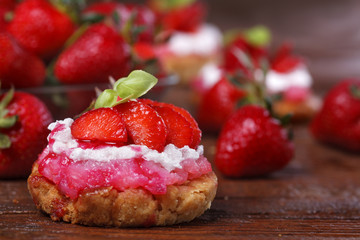 Homemade cake with strawberries on a rustic table