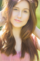Portrait of a beautiful young woman with brown hair