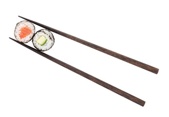 Sushi maki with salmon and cucumber in chopsticks