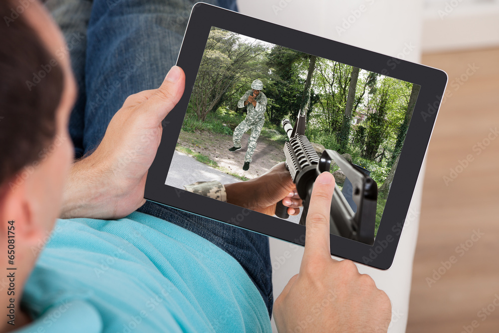 Poster Man Playing Action Game On Digital Tablet