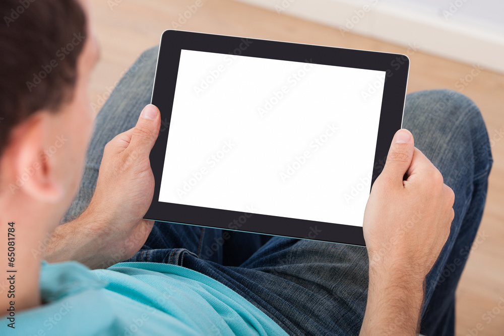 Poster man looking at blank screen of digital tablet