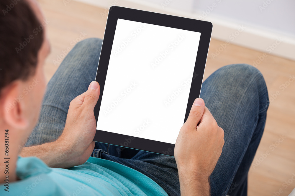 Poster man looking at blank screen of digital tablet