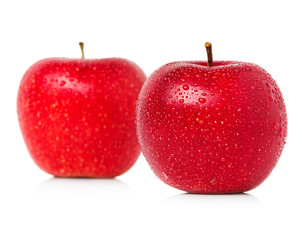 Red apples with water drops isolated