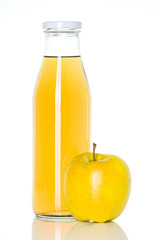 bottle of apple juice with apple