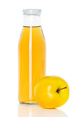 bottle of apple juice with apple