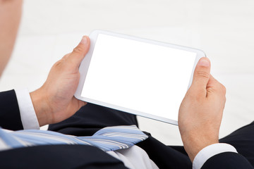 Businessman Using Digital Tablet In Office