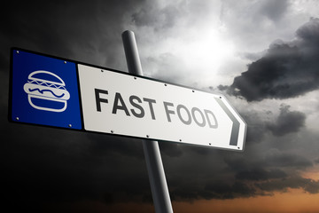Obraz premium Fast food direction. Blue traffic sign.