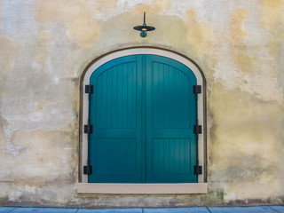 Teal Door on Stone Wall