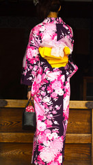 Young woman in a casual summer kimono - yukata garment.