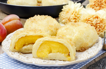 Peach in pastry, popular austrian dish. Garden party table