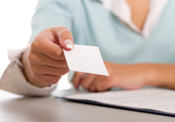 portrait of a young woman with a laptop sitting at the desk