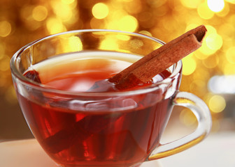 Hot christmas drink with cinnamon sticks