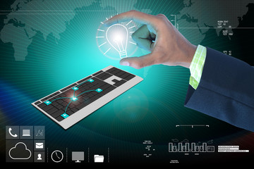 Hand showing the light bulb and computer keyboard
