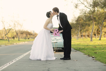 Naklejka premium Happy Bride and Groom Married Outdoors in a Forest