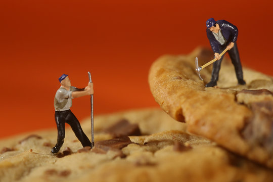  Plastic People Working on Chocolate Chip Cookies