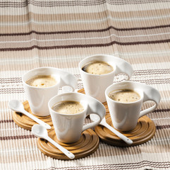 cups of coffee on place mats