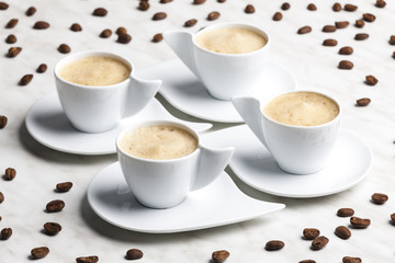 four cups of coffee with milk