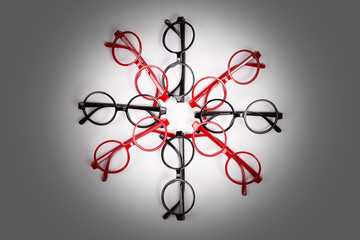 Stack of red and black glasses with vignette