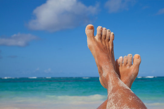 sandy feet on the beach