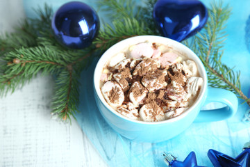 Hot chocolate with cream in color mug,