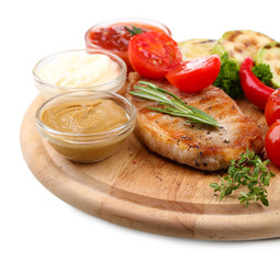 Grilled steak with spices, herbs and vegetables