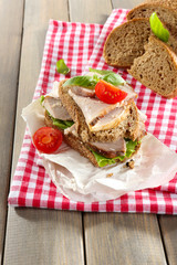 Delicious sandwiches with meet on table close-up