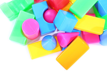 Colorful plastic toys isolated on white