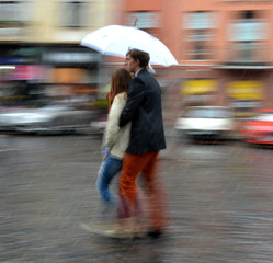 People walking down the street on rainy day