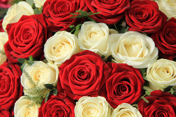 Red and white roses in a wedding arrangement