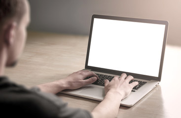 Man using/working on laptop computer