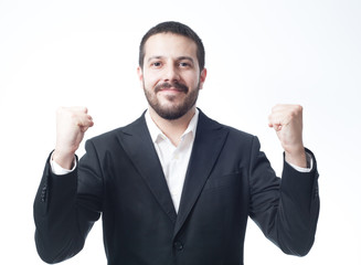 Victorious young businessman. Isolated on white.