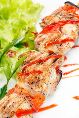 Chicken kebab with tomato sauce